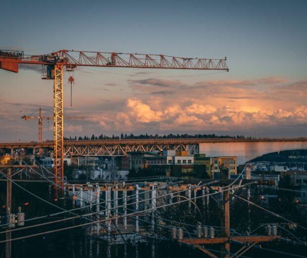 A beautiful view of a construction site in a city during sunset